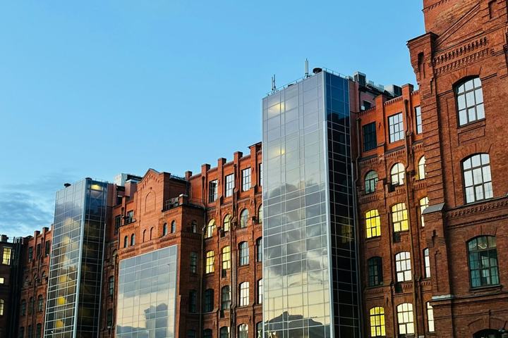 Historic red-brick building joined to a modern glass addition